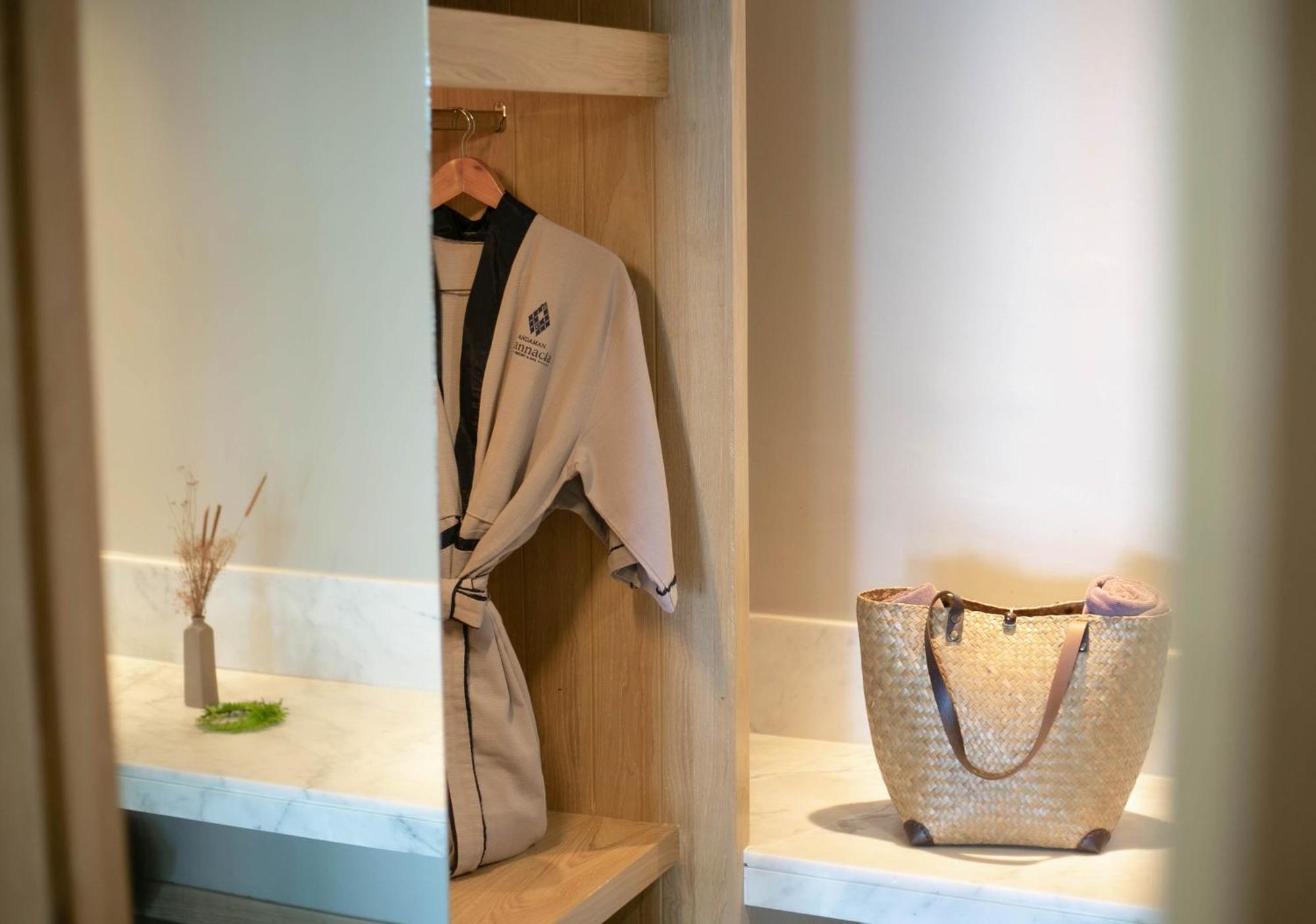 Andaman Cannacia Resort & Spa - Sha Extra Plus Strand Kata Exterior foto A bathrobe hanging in a closet